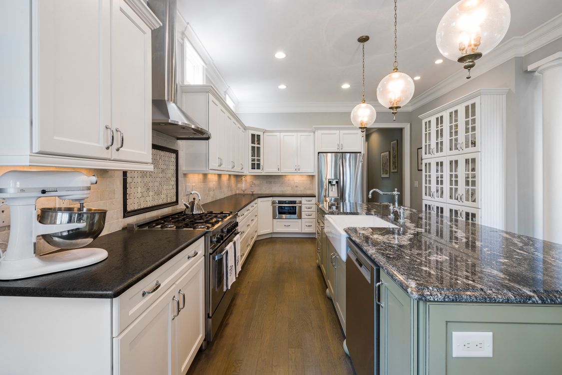Finished kitchen with refreshed cabinetry and detailed trim